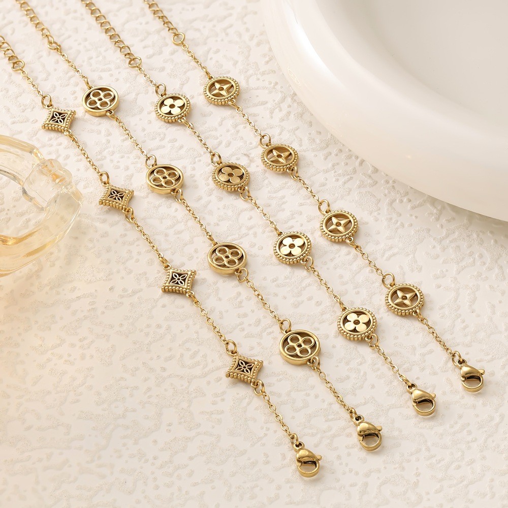 HT ไทเทเนียมเหล็กชุบ 18k Gold Four-Leaf Clover สร้อยข้อมือหญิง All-Match High-End สแตนเลส