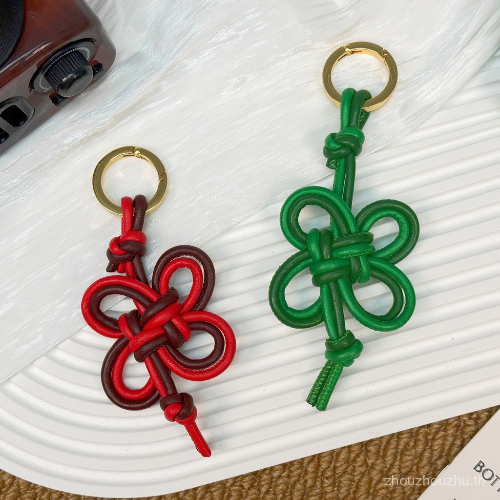 ใหม่จี้ทอมือ/Sheepskin Ruyi Knot พวงกุญแจ/จี้หนังแท้/ของขวัญระดับไฮเอนด์