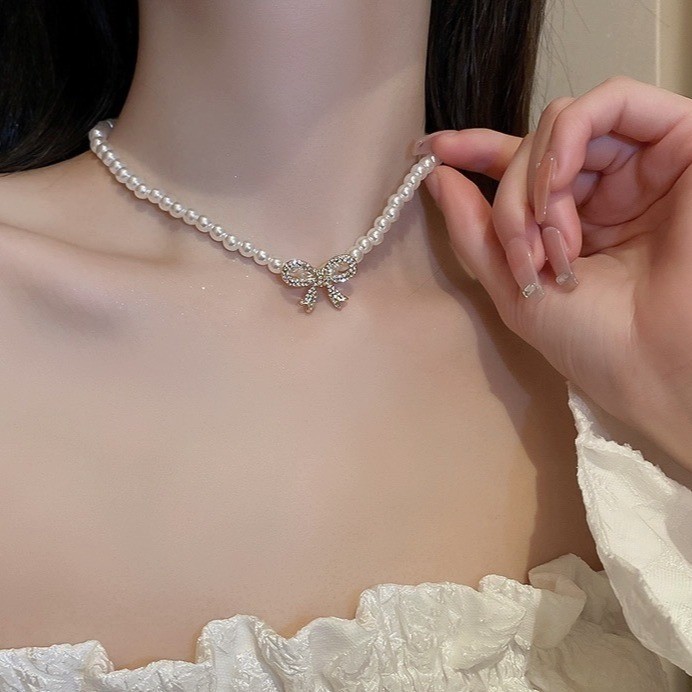 สไตล์ใหม่ Cubic Zirconia ฝัง Bow Knot เลียนแบบสร้อยคอมุกหญิงแฟชั่น Classy เครื่องประดับของขวัญ AMS8
