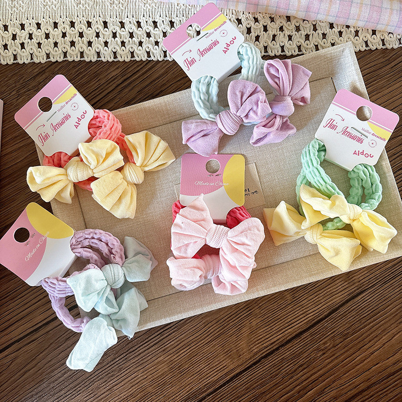 ยางรัดผมแบบยืดหยุ่นสำหรับเด็กผู้หญิง ลายโบว์น่ารัก เพื่อทรงผมประจำวัน