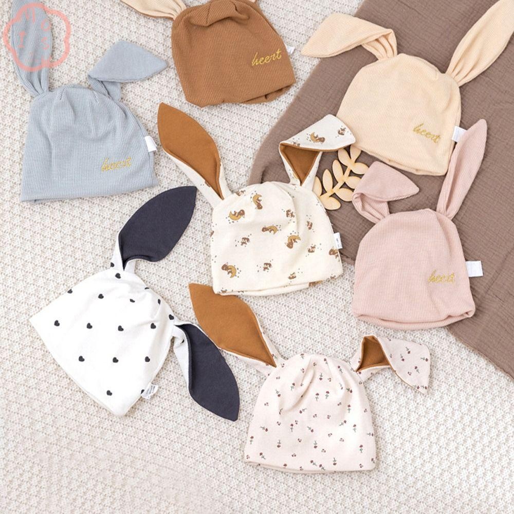 หมวกทรงกระต่าย แบบบีนนี่สองชั้น ทำจากผ้าฝ้ายหูย้วย ออกแบบมาให้อบอุ่นและน่ารักสำหรับเด็กทารก และเหมาะสำหรับการถ่ายภาพ