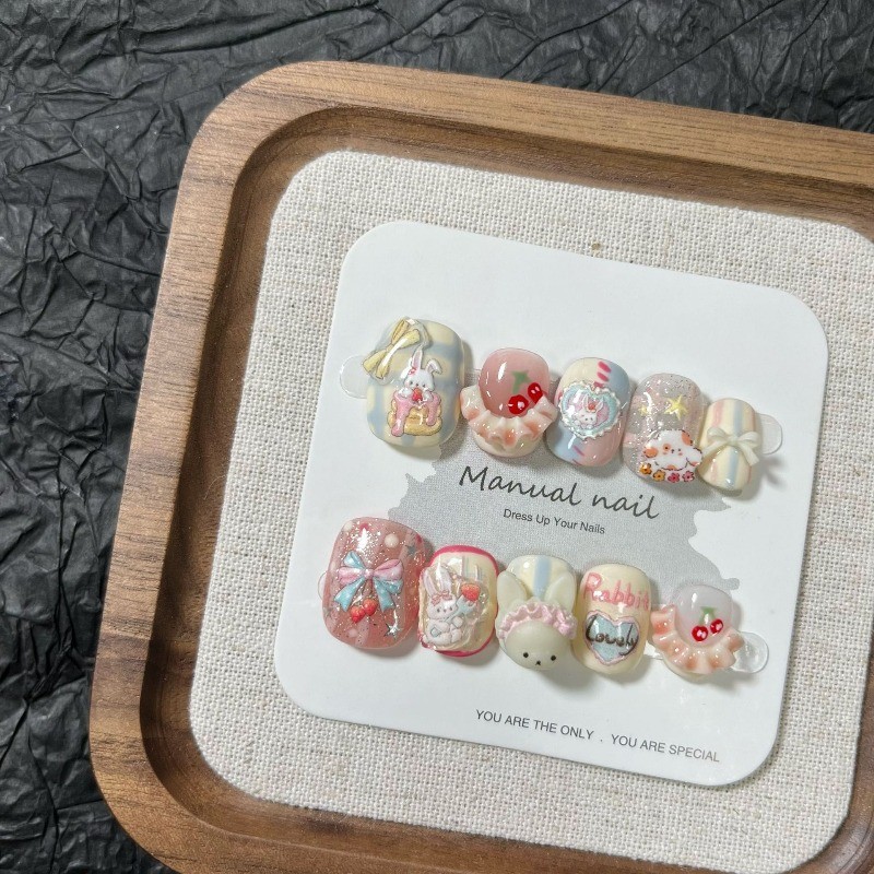 10 ชิ้นน่ารัก Macaron Handmade กดบนเล็บการ์ตูนกระต่ายกระโปรงเชอร์รี่โบว์เล็บปลอมที่ถอดออกได้นํากลับมาใช้ใหม่ได้