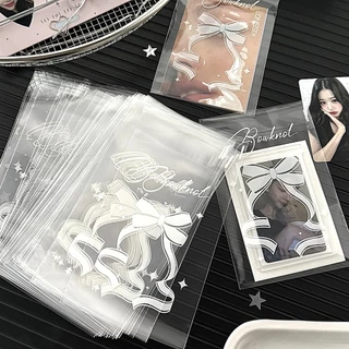 ถุงซีลเก็บการ์ดไอดอล 100ชิ้น ลายโบว์ดาว 7แบบ โปร่งใส กันน้ำ กันฝุ่น กันรอย ซองใส่โฟโต้การ์ด การ์ดสะสม 8x10+3ซม