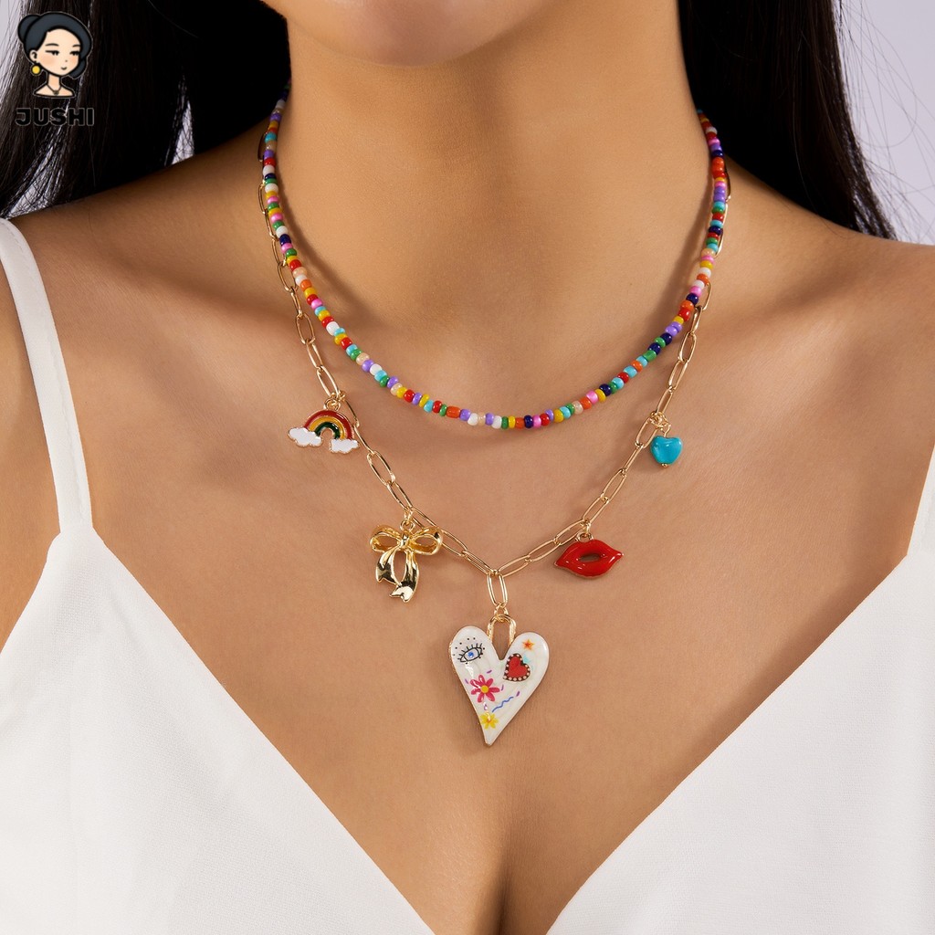 JUSHI Sweet Love Bow Rainbow ลูกปัดหลายจี้ 2 ชั้นชุดสร้อยคอผู้หญิง Kawaii Y2K ความงาม Dainty Layering เครื่องประดับของขวัญ