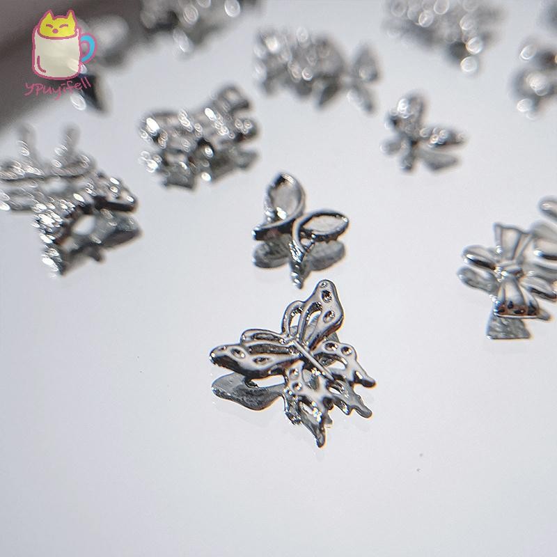 [YPU] 10 ชิ้นเงินเฟื่อผีเสื้อตกแต่งเล็บBling Crystal Zircon Bowเล็บตกแต่ง 3Dโลหะเล็บอุปกรณ์เสริมMilk