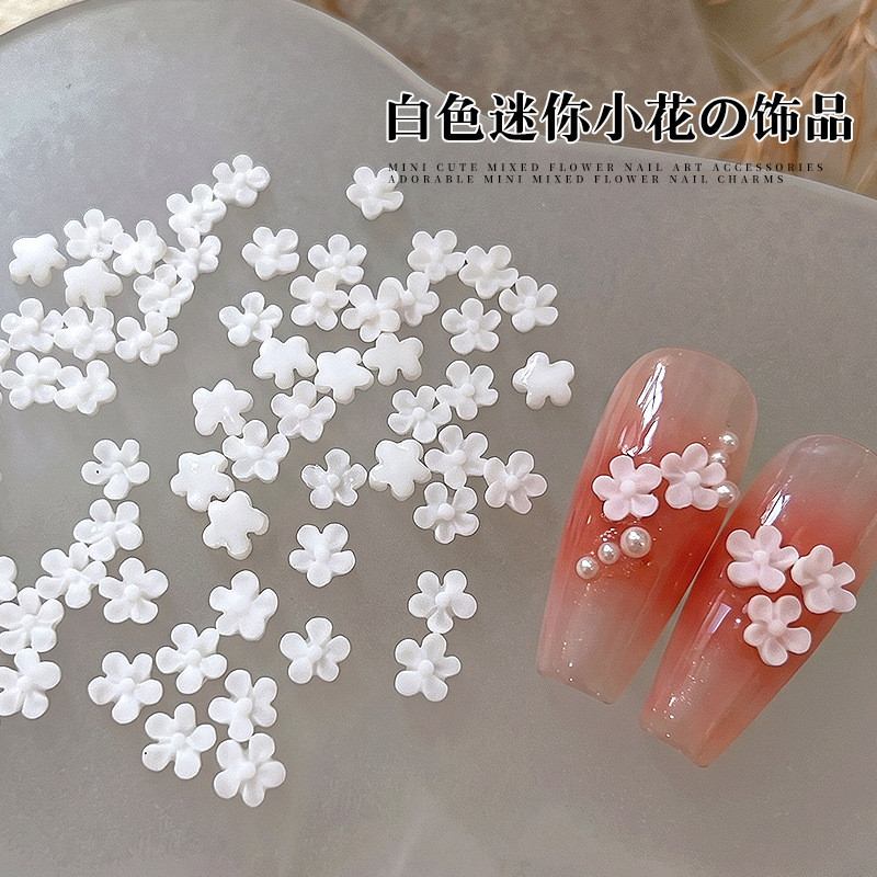ขายส่ง ใหม่สไตล์ดอกไม้สีขาวอุปกรณ์แต่งเล็บสามมิติมินิห้ากลีบดอกไม้สวมใส่เล็บเรซิ่นเล็บอุปกรณ์เสริม