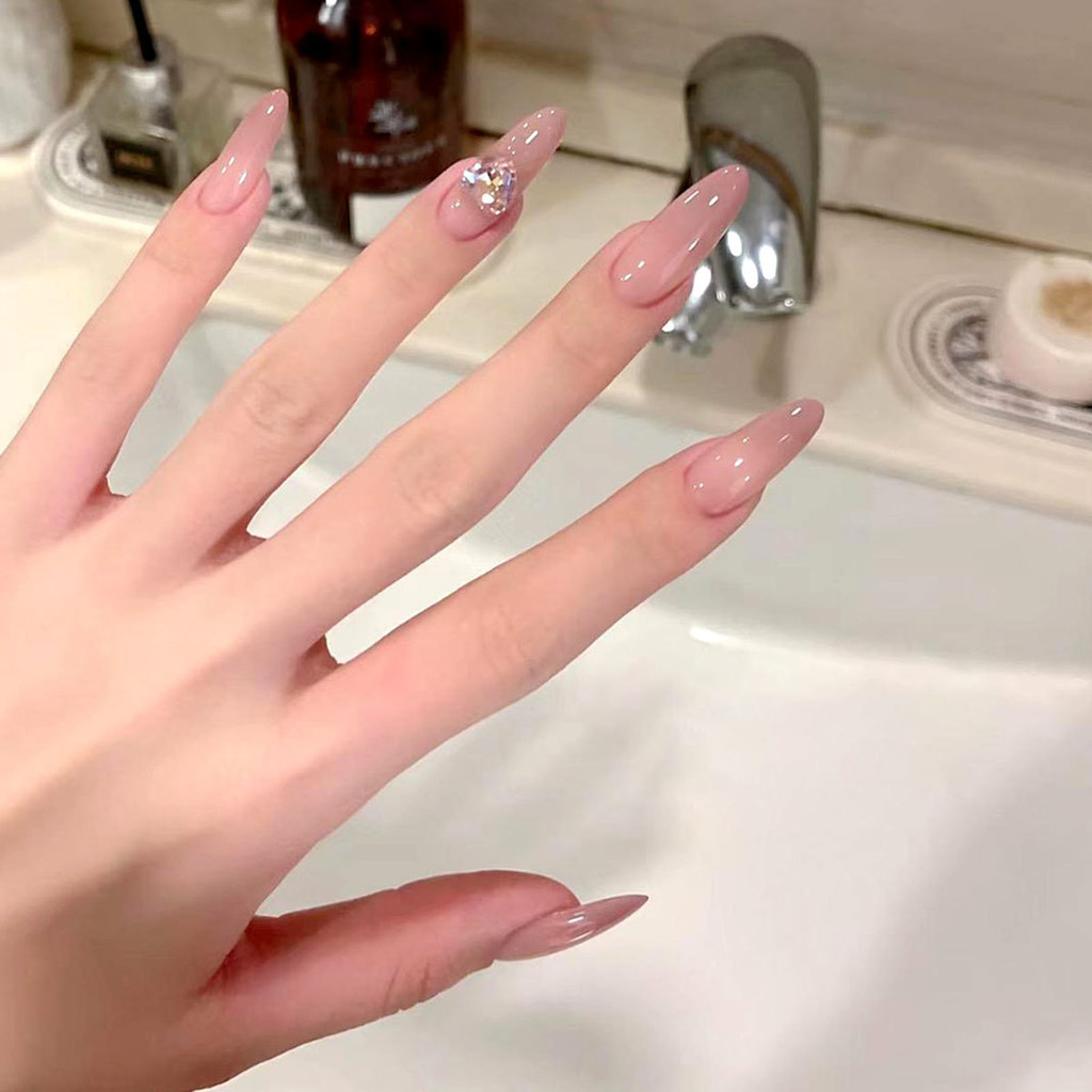 เล็บแบบกดยาวพิเศษสําหรับผู้หญิงรูปไข่สีอ่อนโยนเล็บเทียมแบบใช้ซ้ําได้สําหรับร้านเสริมสวยและผู้หญิง Na