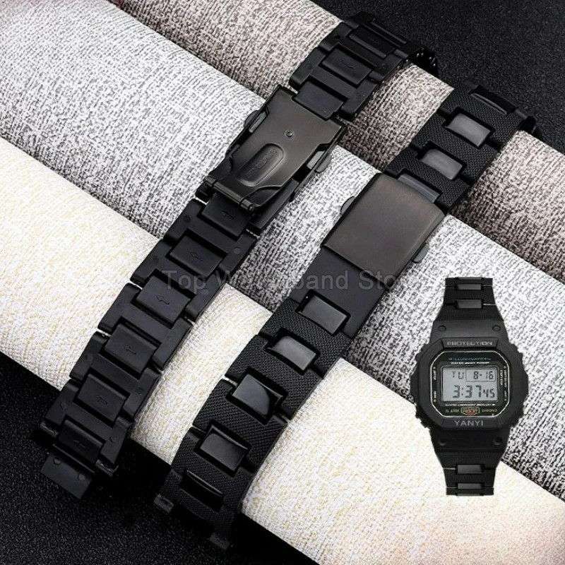 ​​สําหรับ Casio สายนาฬิกาเหล็กพลาสติกอินเทอร์เฟซพิเศษกันกระแทก DW5600 GBX100 GA110 สีดํา 16 มม.สายกั