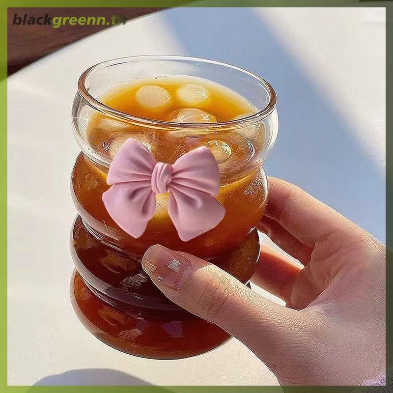 บ่น แก้วโบว์ถ้วยน้ําน่ารักการ์ตูนโบว์ถ้วยแก้วลายน่ารัก ดูเดิล แก้วกาแฟครัวเรือนผลไม้ชาน้ํามะนาวสาวของขวัญ .