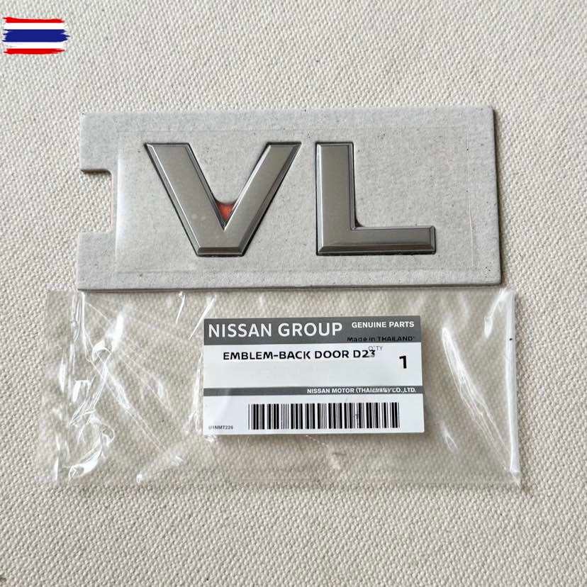 แท้ศูนย์ โลโก้ VL ตัวหนังสือฝ้าย NAVARA NP300 ขนาด 9x3.5cm D23 AYE-93496-4JA0B