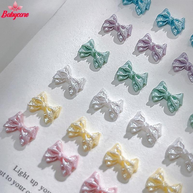 <BYCE-t> 50PCS Pearlescent 3D เล็บโบว์ Charm สําหรับเล็บตกแต่งออกแบบ Kawaii เล็บเครื่องมือ Bow-knot DIY Craft Supplies