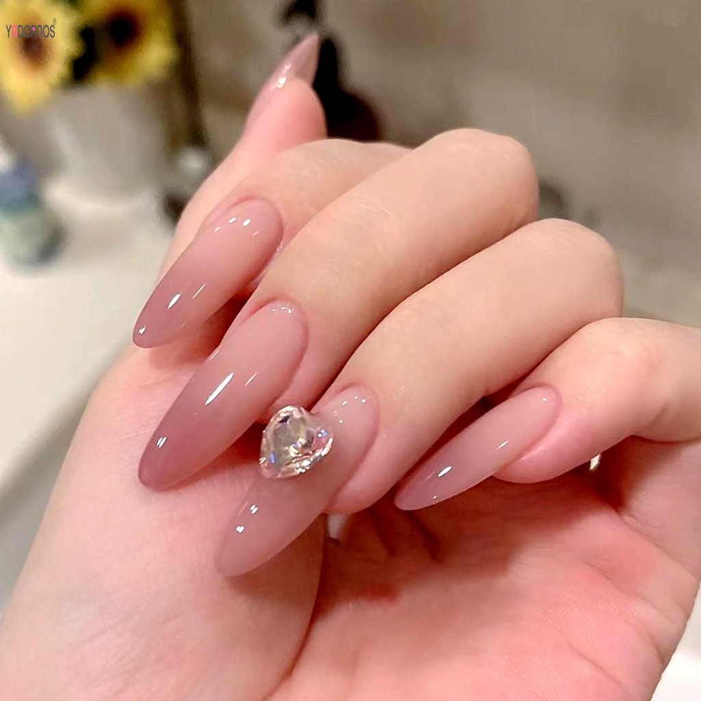 เล็บแบบกดยาวพิเศษสําหรับผู้หญิงรูปไข่สีอ่อนโยนเล็บเทียมแบบใช้ซ้ําได้สําหรับร้านเสริมสวยและผู้หญิง Na