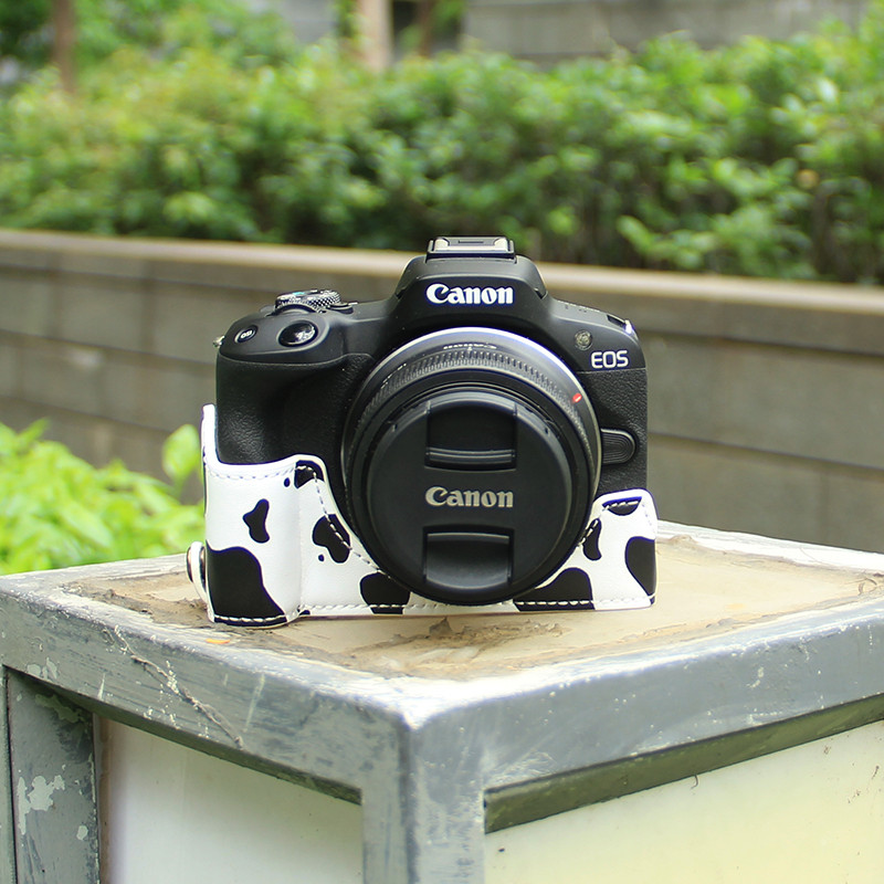 เหมาะสําหรับกระเป๋ากล้อง Canon R50/R100 7 R5D4R6 ฐาน 200d รุ่นที่สอง RP หนัง 90D850D ครึ่งฝาครอบ