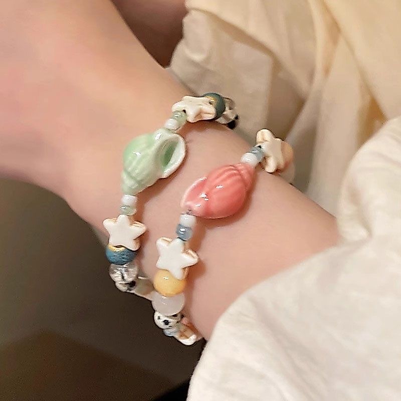 สร้อยข้อมือเซรามิกดาวสังข์น่ารัก โดปามีน สร้อยข้อมือการ์ตูนลูกปัดยางยืด