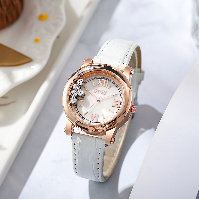 OUKI เข็มขัดแฟชั่นสุภาพสตรีนาฬิกาควอตซ์ตัวเลขโรมันขนาด Rhinestone Ball Simple นาฬิกาสุภาพสตรี 9.19