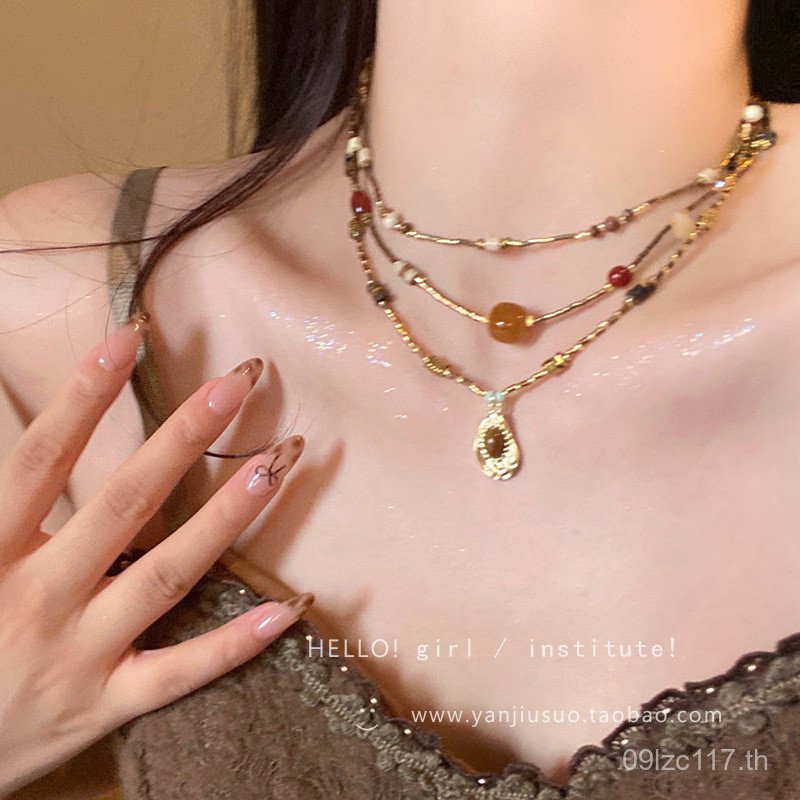 Retro จี้สร้อยคอผู้หญิงเสื้อกันหนาวอุปกรณ์เสริมหรูหราสร้อยคอ Tiger Eye Stone 2025 High-End Niche สไต