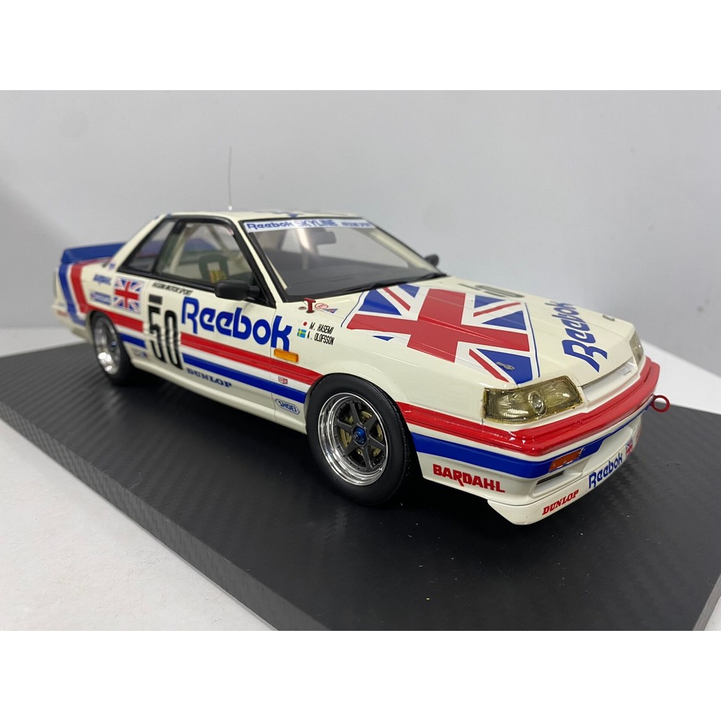TSM TOMYTEC 1/18 Reebok Skyline R31 GTS-R รถเรซิ่นรุ่นสินค้าจํานวนมากมีกล่องโฟมสินค้าพื้นผิวสีเก่าเห