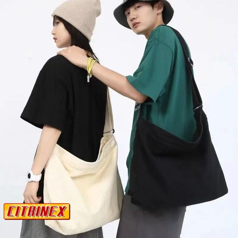 กระเป๋าซิตริเน็กซ์ แบบสะพาย-crossbody ผลิตจากผ้าแคนวาส อเนกประสงค์ มีความจุมาก เหมาะสำหรับการเดินทางและใช้งานประจำวัน สำหรับทั้งผู้หญิงและผู้ชาย