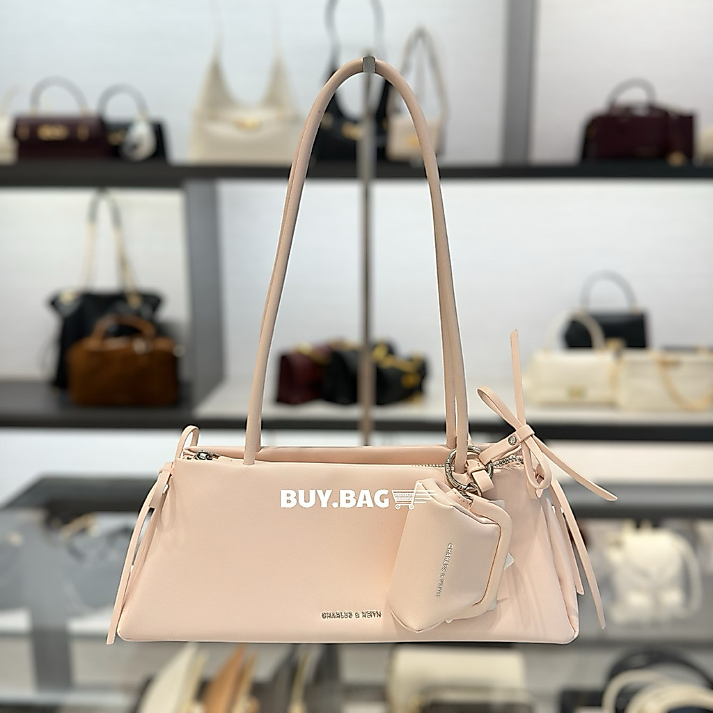 CHARLES & KEITH ( เก็บโค้ดลด30% ) กระเป๋าสะพายไหล่ทรงสี่เหลี่ยมคางหมูแบบยาวตกแต่งด้วยโบว์รุ่น Hazel