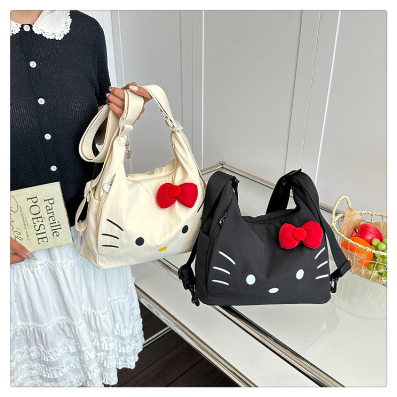 เวอร์ชั่นเกาหลี ins การ์ตูน Hello Kitty กระเป๋าเป้สะพายหลังหญิงแฟชั่นกระเป๋าสะพายประณีตกระเป๋าเป้สะพายหลังความจุขนาดใหญ่ All-Match