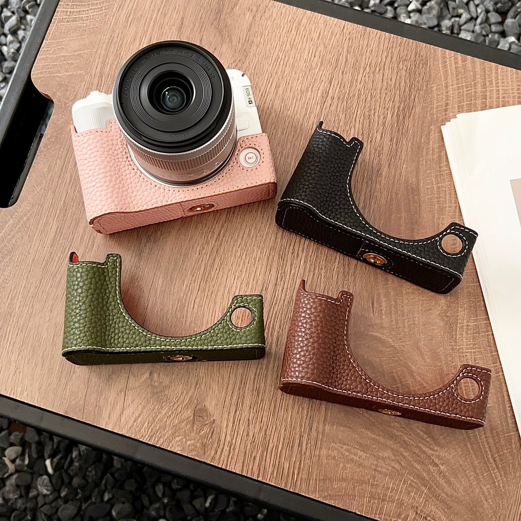 เหมาะสําหรับ Canon R50V เคสหนังฐาน r50v Micro กระเป๋ากล้องเดี่ยว R50V เคสป้องกันแบบพกพาครึ่งกรณี