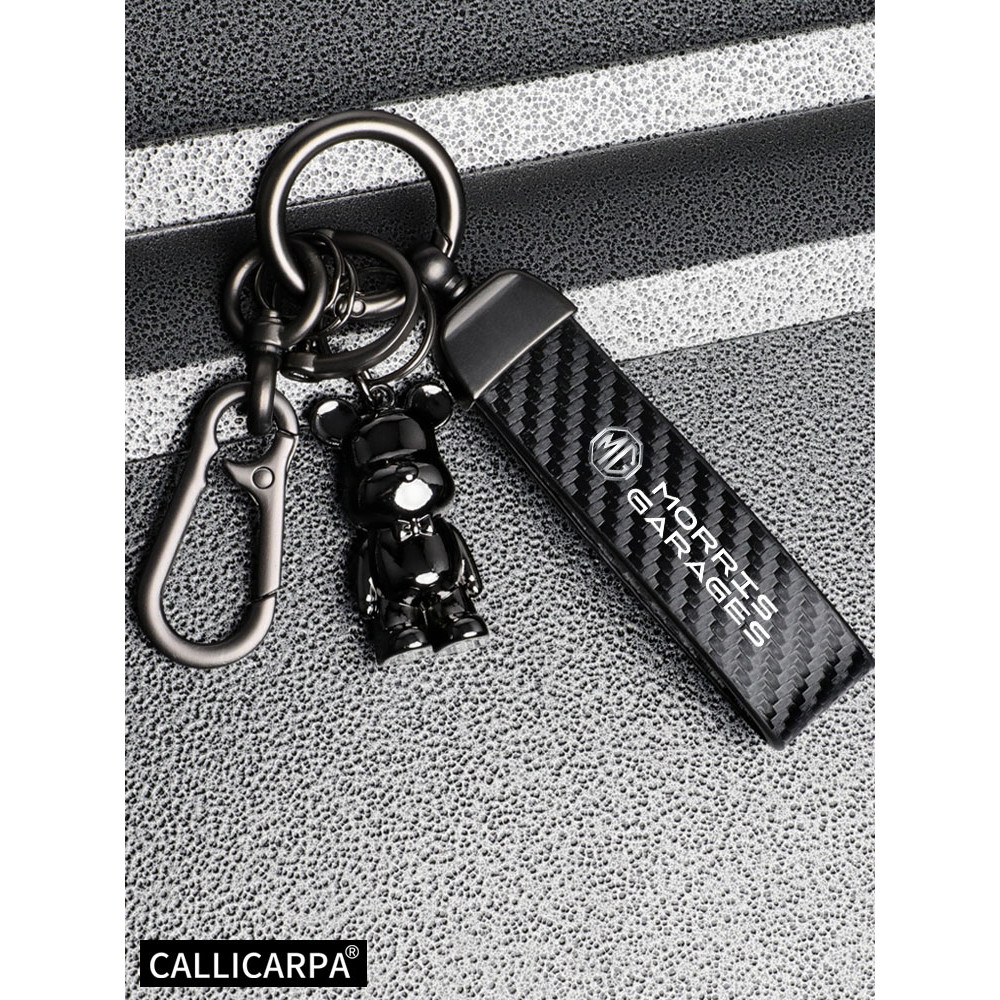 MG รถหนังนิ่มหนังพวงกุญแจจี้ Key Chain ผู้ถือคาร์บอน Patter กุญแจรถ Trinket พวงกุญแจสําหรับ MG3 MG5 MG6 MG7 EP Pluse MG TF ZR ZS ES HS GS Morris 3 อุปกรณ์เสริม