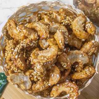 เม็ดมะม่วงหิมพานต์เคลือบน้ำตาล ขนมหลอด 1แพ็คบรรจุ10ห่อ