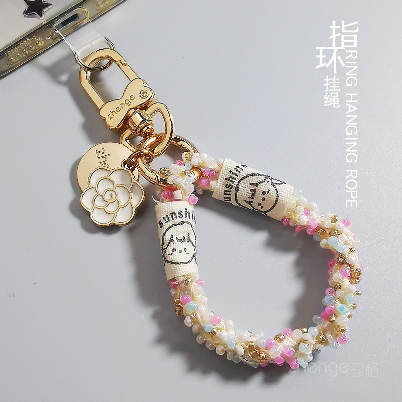 โทรศัพท์มือถือ Lanyard แหวนสไตล์ High-End Hand-Made ins ผู้หญิงแฟชั่น Camellia ข้าวลูกปัด Thumb จี้ท่องเที่ยวกลางแจ้ง