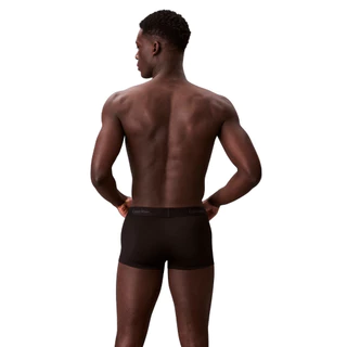 CALVIN KLEIN กางเกงในผู้ชาย Icon Logo Graphic ทรง Low Rise Trunk รุ่น NB4440 UB1 - สีดำ