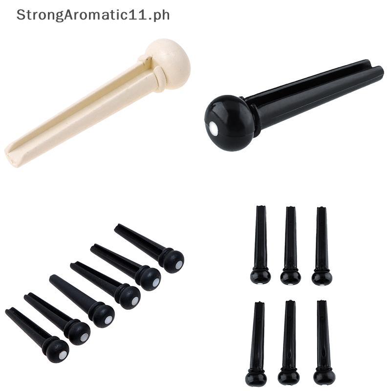 StrongAromatic ชุด 6 ชิ้น Bla Ebony Bridge Pins พร้อมจุดเชลล์สําหรับกีตาร์อะคูสติกคุณภาพ
6 ชิ้น Ebon