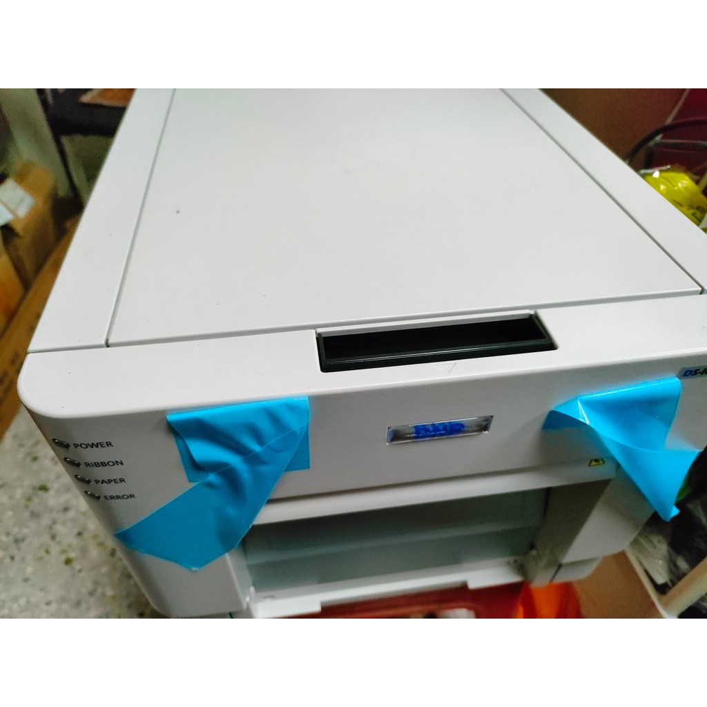 เครื่องพิมพ์ DNP rx1 กระดาษ & ริบบิ้น (รวมถึง 1400 พิมพ์) มาพร้อมตัวอย่างโฟลเดอร์ภาพถ่ายของเรา! (Eve
