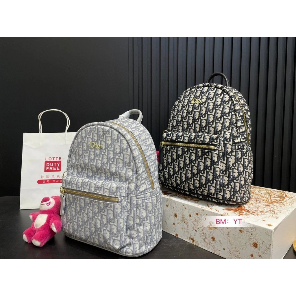 Dior Double-Shoulder Shipment ใหม่สไตล์ผู้ชายผู้หญิงด้านหลังทั้งหมดดูดีเป็นกระเป๋าเป้สะพายหลังที่ผ่า