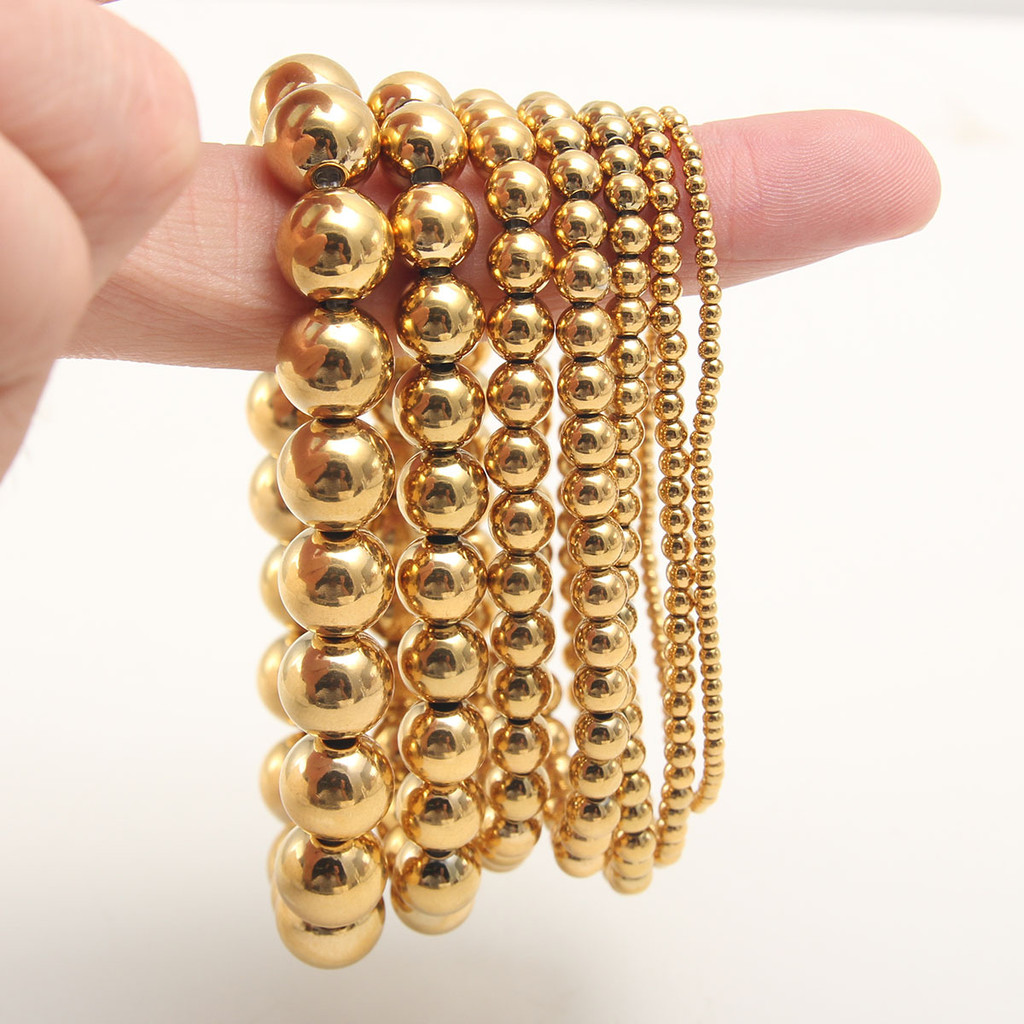 ยุโรปอเมริกันสร้อยข้อมือยืดหยุ่นสร้อยข้อมือสแตนเลสหญิงแฟชั่น Golden Steel Ball 3mm4mm6mm8mm ลูกปัด 8