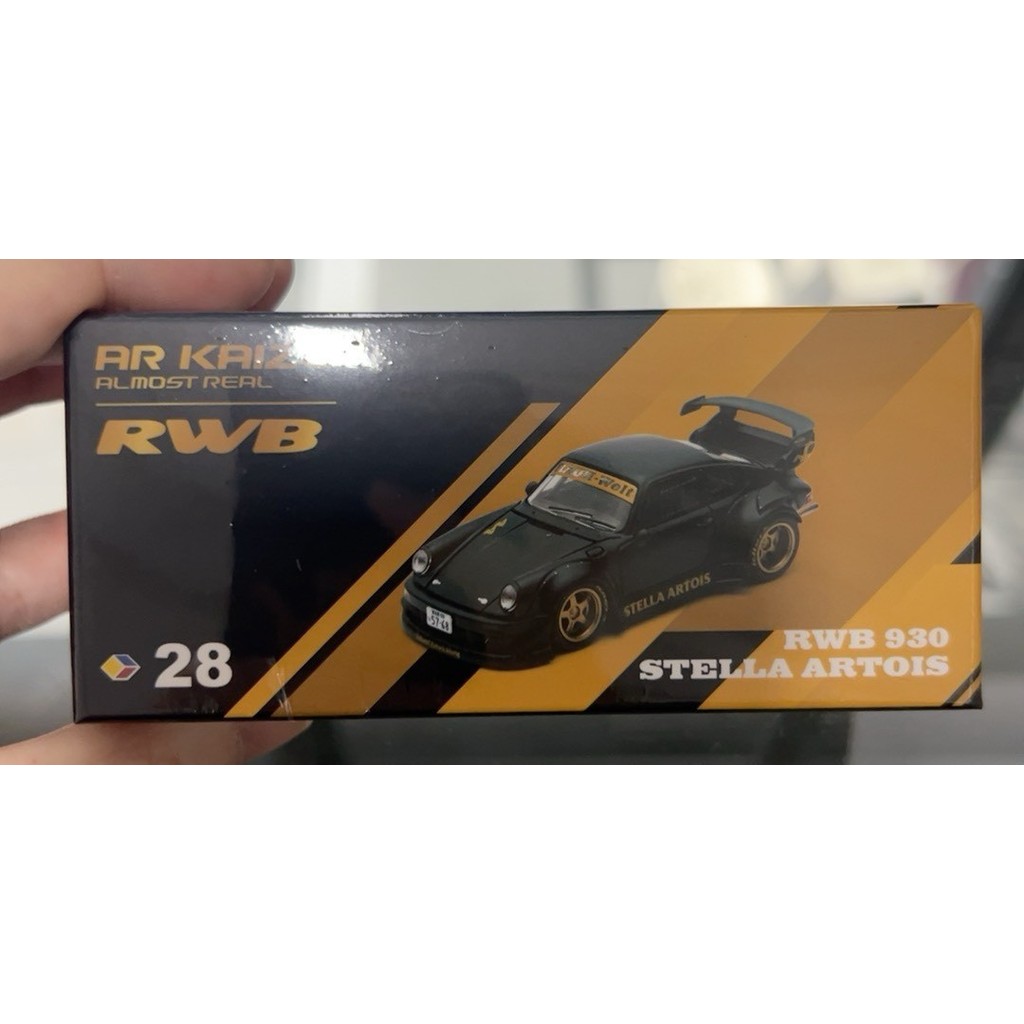 AR 1/64 RWB 930 STELLA ARTOIS หมายเลขสินค้า: 6K0000101ไฟล์โมเดล สีดําด้านนี้, ดุมล้อสีทอง, ปีกหางใหญ