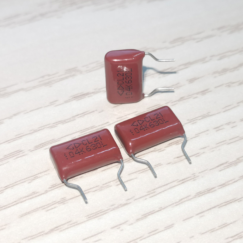 Xiamen Ferra C212J104K6BC000 CL21 104K 630VDC ตัวเก็บประจุฟิล์มโพลีเอสเตอร์เมทัลลิก