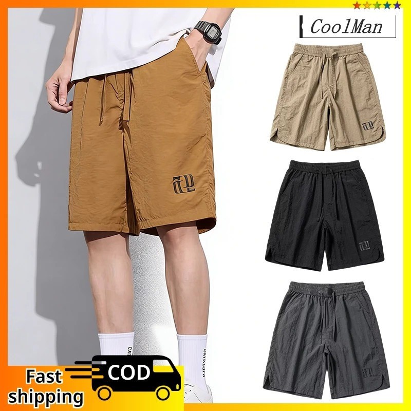กางเกงขาสั้นบรรทุกสินค้าสบายผู้ชาย Loose Fit Streetwear กางเ