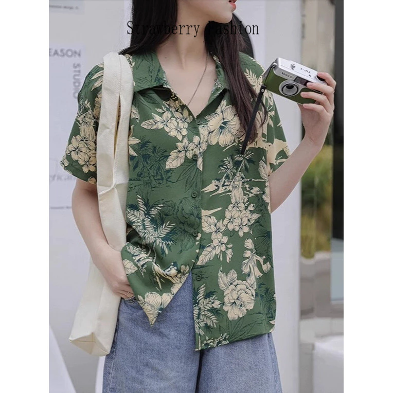 เสื้อเชิ้ตลายดอก ผ้าบาง ทรงหลวม สไตล์ฮาวาย ย้อนยุคฮ่องกง รุ่นใหม่ฤดูร้อน 2026 เหมาะใส่เที่ยวชายหาด สำหรับผู้หญิง