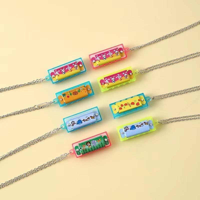 Newsmallbrains มินิการ์ตูน Harmonica พร้อมสร้อยคอ 10 ชิ้นปลอดภัยเด็กของเล่นดนตรีสําหรับงานเลี้ยงวันเ