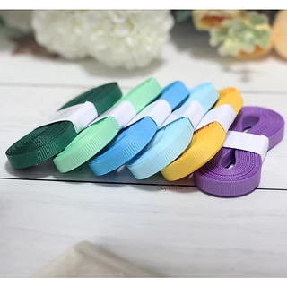 ริบบิ้นผ้ากรอสเกรน ขนาดหน้ากว้าง 0.6 cm ยาวม้วนละ 5 หลา มีให้เลือก 64 สี