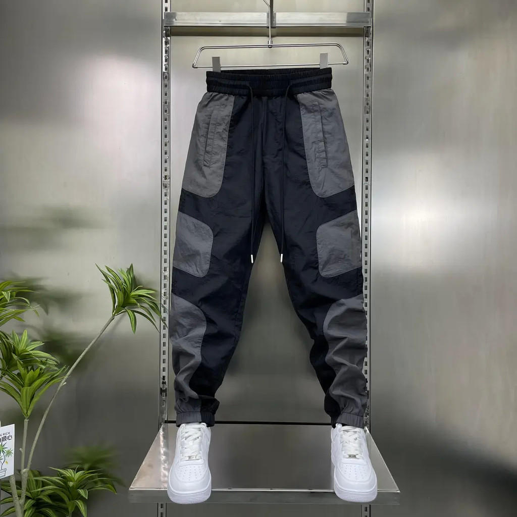 [ผู้ชายที่น่าพอใจกําลังสวมใส่] ผู้ชายฤดูร้อนสไตล์บางสี-Blocking Foot-Leggings กางเกงกีฬาลําลองอินเทรนด์ใหม่