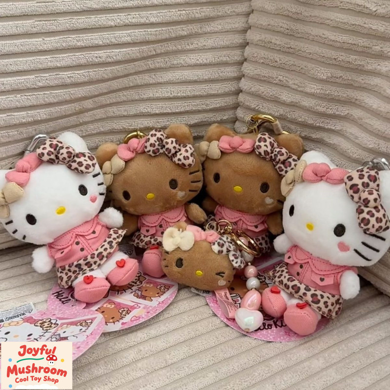 สินค้าพร้อมส่ง อเมริกันเสือดาวพิมพ์Hello Kittyตุ๊กตาจี้สร้างสรรค์ฤดูร้อนหนังสีดําHello Kittyตุ๊กตาพวงกุญแจมูลค่าสูงสาวกระเป๋าเครื่องประดับของขวัญสําหรับป