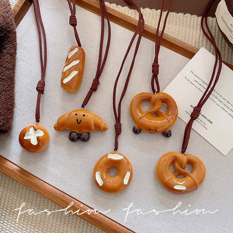 อัลคาไลน์น้ําขนมปัง Bagel สร้อยคอผู้หญิง Niche Design Feeling ฤดูใบไม้ร่วงฤดูหนาวเสื้อกันหนาวจี้เสื้