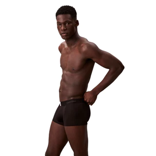 CALVIN KLEIN กางเกงในผู้ชาย Icon Logo Graphic ทรง Low Rise Trunk รุ่น NB4440 UB1 - สีดำ