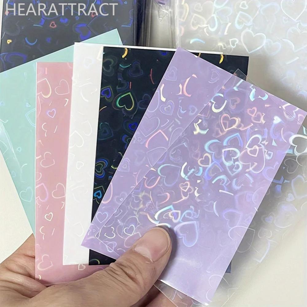 HEARATRACT 50 ชิ้นเลเซอร์รูปหัวใจระยิบระยับ PP การ์ดแขนป้องกันฟิล์มการ์ดสําหรับ Id นักเรียนการ์ดเกม 