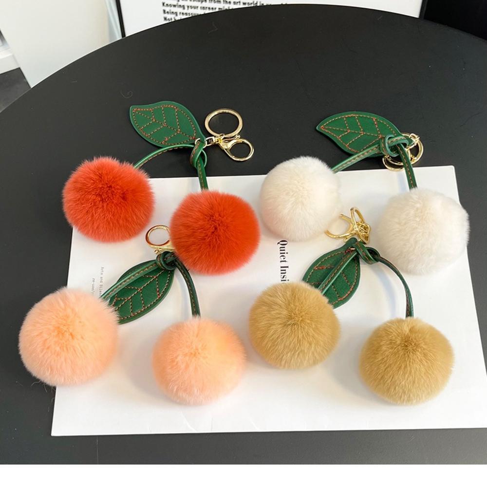 1PC Fluffy Double Cherry Pom Pom พวงกุญแจ Soft Faux Fur Ball สีเขียวเย็บหนัง Leaf Gold Lobster Clasp นักเรียนกระเป๋าเป้สะพายหลังกระเป๋าถือตกแต่งของขวัญสําหรับสาว