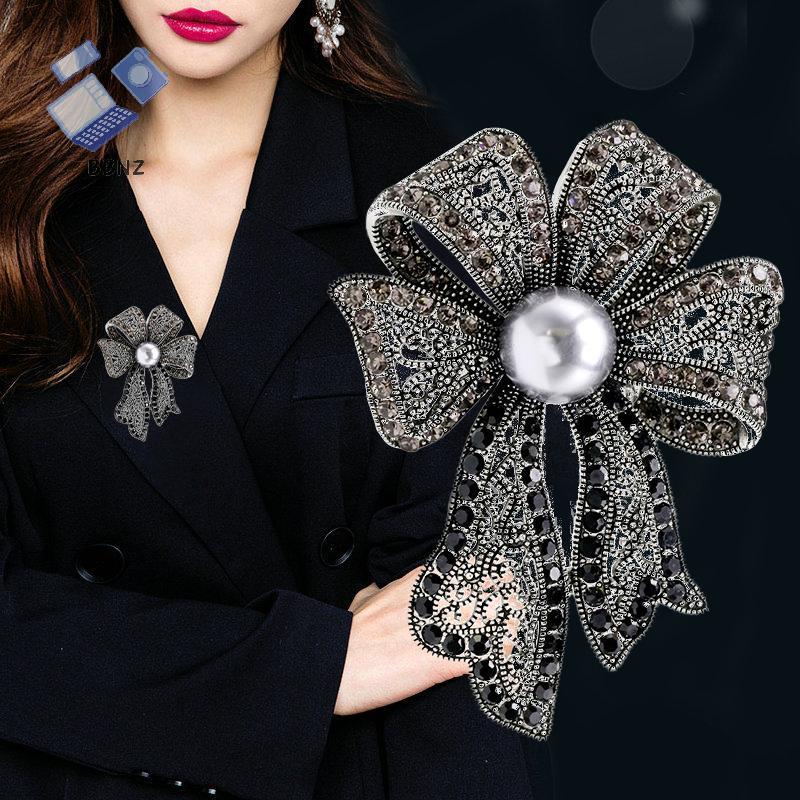 [BBNZ] เข็มกลัด Bowknot คริสตัลและไข่มุก เหมาะสำหรับเสื้อโค้ทและงานปาร์ตี้