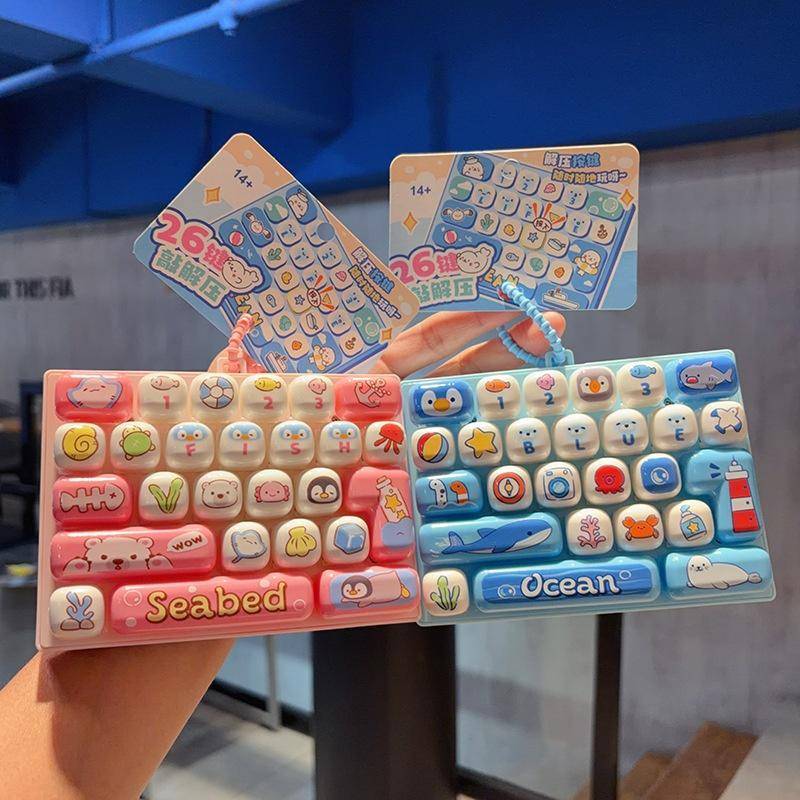 [Smw] Mini 26 Key คีย์บอร์ดพวงกุญแจความเครียดบรรเทา Fidget ของเล่น Creative Sensory ของเล่นสําหรับผู้ใหญ่นักเรียน Office Desk Decor ของขวัญ [TH]