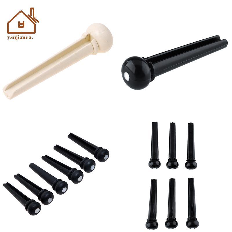 YANCA ชุด 6 ชิ้น Bla Ebony Bridge Pins พร้อมจุดเชลล์สําหรับกีตาร์อะคูสติกคุณภาพ
6 ชิ้น Ebony Bridge 