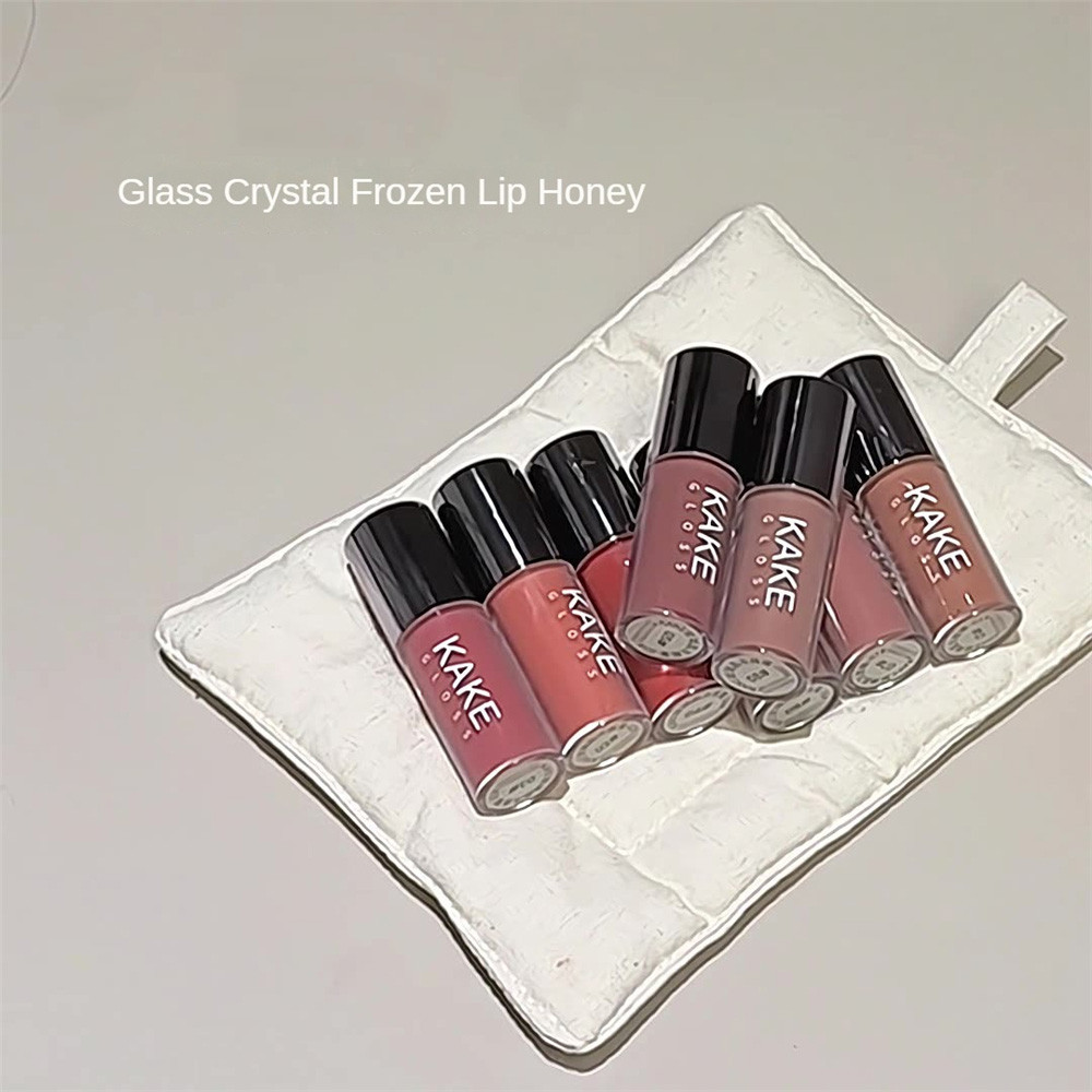 KAKE ลิปกลอสปรับปรุงความแห้งกร้าน ลิปแคร์ สบาย ลิปสติกทาง่าย ลิปสติกที่ปลอดภัย กลิ่นหอมสดชื่นและบางเ