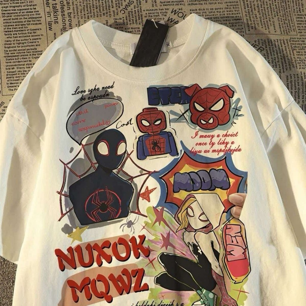 การ์ตูนที่ไม่ซ้ํากันเดอร์แมนพิมพ์แขนสั้นเสื้อยืดผู้ชายผู้หญิงรอบคอขนาดใหญ่สบายๆหลวมแขนสั้นด้านบน2026